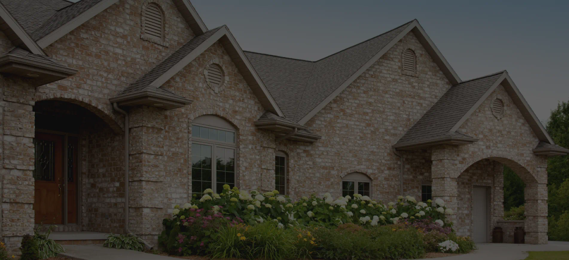 new brick home with asphalt roof shingles 2